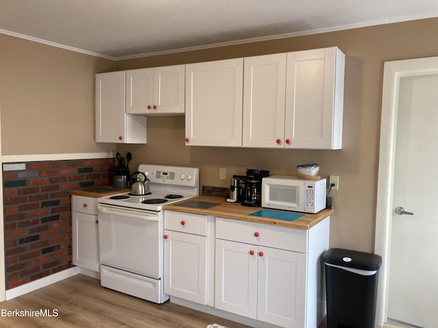 kitchen with white appliances, white cabinetry, light wood-style flooring, crown molding, and wooden counters