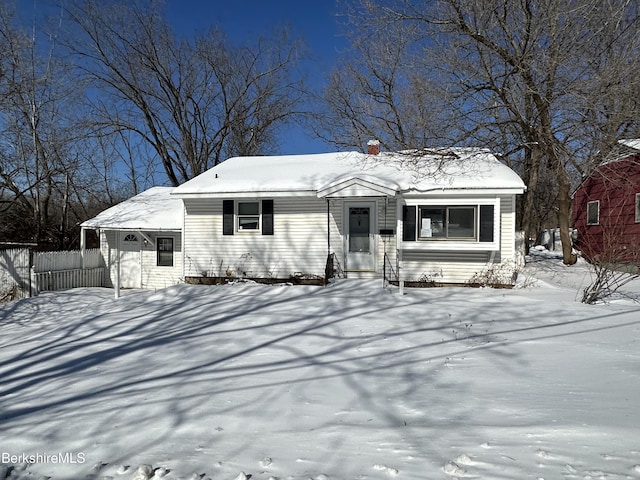 view of front of home featuring fence