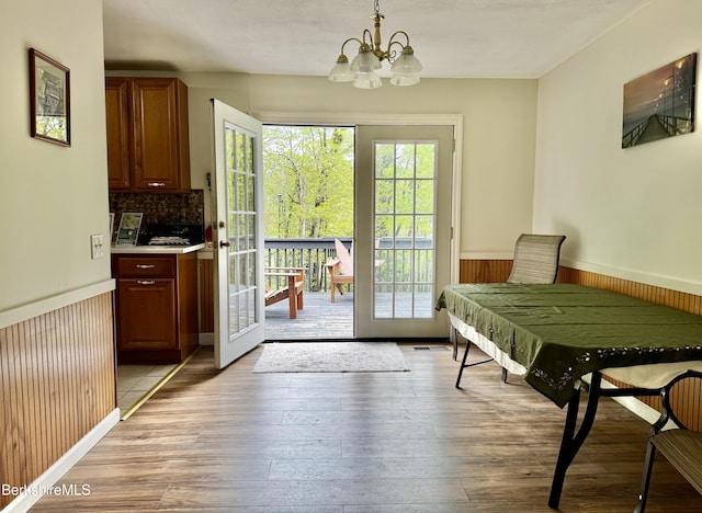 732 Main St, Becket, MA 01223 - entryway with a chandelier, healthy amount of natural light, wainscoting, light wood-style floors, and french doors