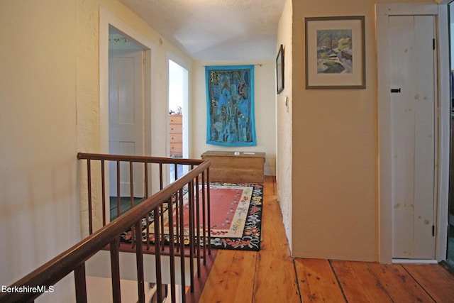 196 Huntington Rd, Worthington, MA 01098 - hall featuring wood-type flooring and an upstairs landing