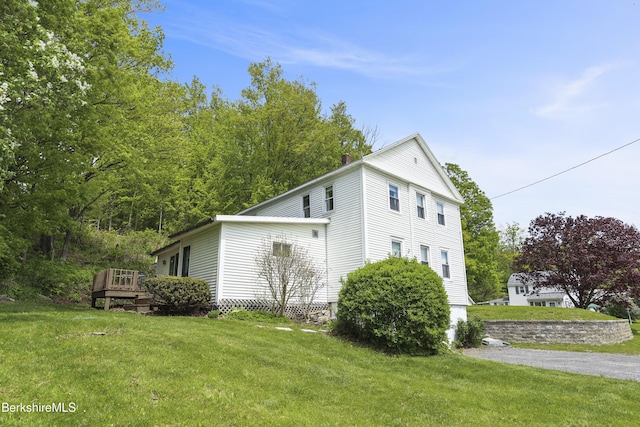203 Main St, Hancock, MA 01237 - view of property exterior featuring a lawn, a deck, and a chimney