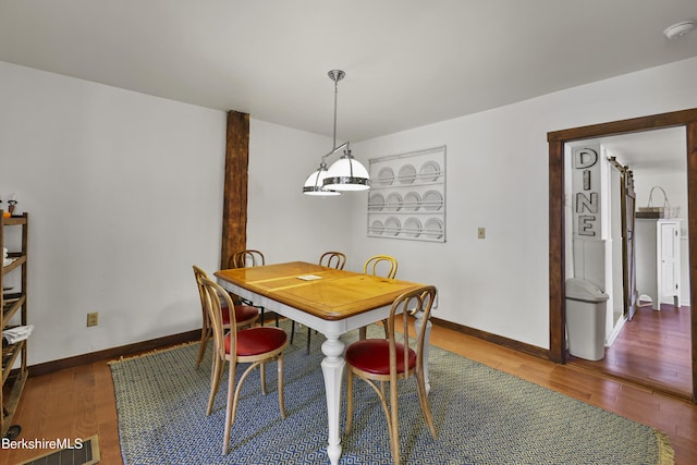 203 Main St, Hancock, MA 01237 - dining room with wood finished floors, built in shelves, and baseboards