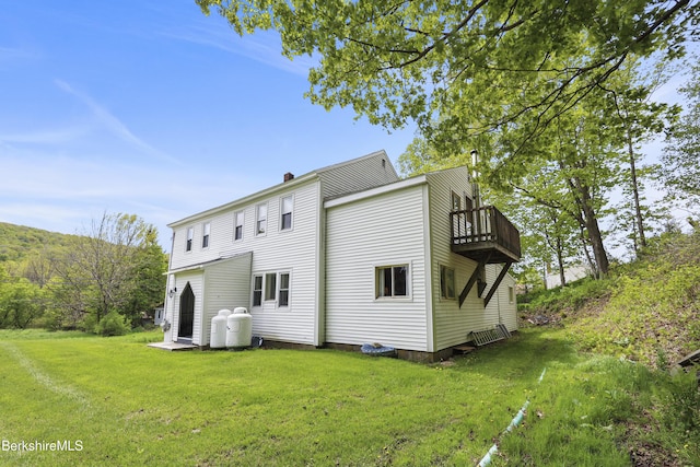 203 Main St, Hancock, MA 01237 - rear view of house featuring a yard, a chimney, and a balcony