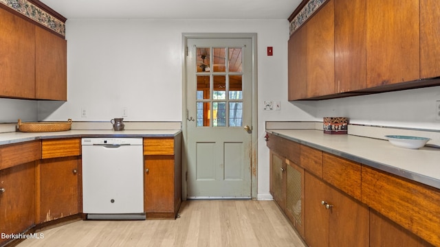 147 Hurlburt Rd, Great Barrington, MA 01230 - kitchen with dishwasher, light wood finished floors, brown cabinets, and light countertops