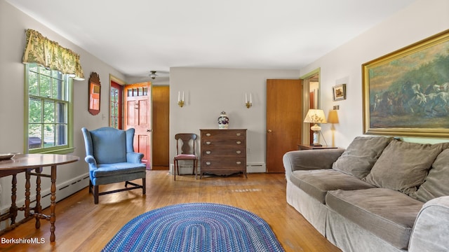 147 Hurlburt Rd, Great Barrington, MA 01230 - living area featuring wood finished floors and a baseboard radiator