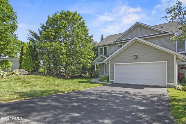 12 Alpine Trl Unit 12, Pittsfield, MA 01201 - view of front facade with asphalt driveway, a garage, a front yard, and a shingled roof