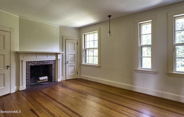 319 Under Mountain Rd, Lenox, MA 01240 - unfurnished living room featuring wood finished floors, plenty of natural light, and a fireplace