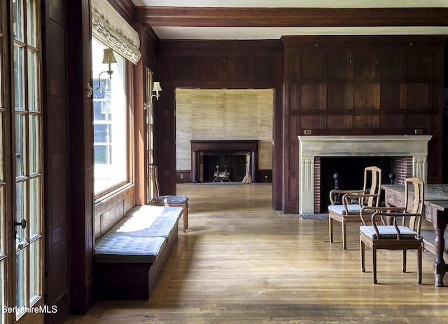 319 Under Mountain Rd, Lenox, MA 01240 - living area with a fireplace, wood finished floors, and wooden walls