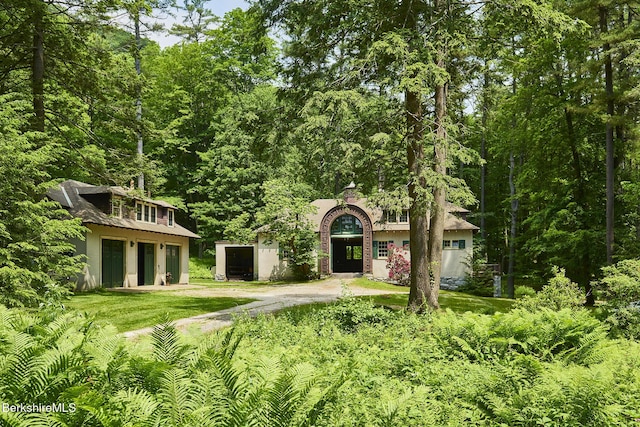 319 Under Mountain Rd, Lenox, MA 01240 - view of front of home with dirt driveway and stucco siding