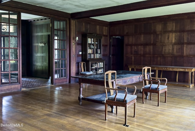 319 Under Mountain Rd, Lenox, MA 01240 - dining space with wood finished floors, beam ceiling, and wooden walls