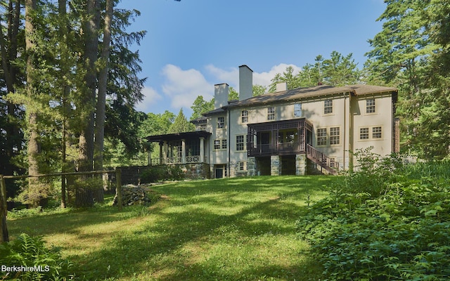 319 Under Mountain Rd, Lenox, MA 01240 - rear view of property with a chimney, stairs, and stucco siding