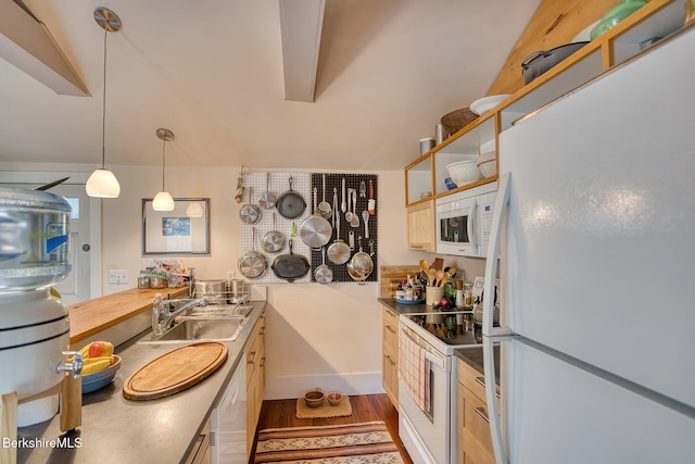 kitchen with pendant lighting, white appliances, dark hardwood / wood-style floors, and sink