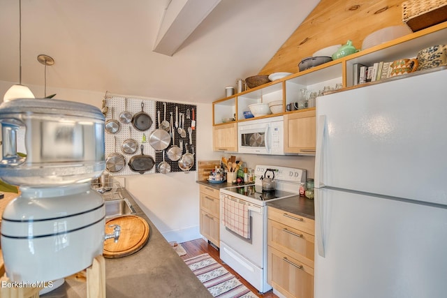 kitchen featuring white appliances, dark wood-type flooring, vaulted ceiling, light brown cabinetry, and decorative light fixtures