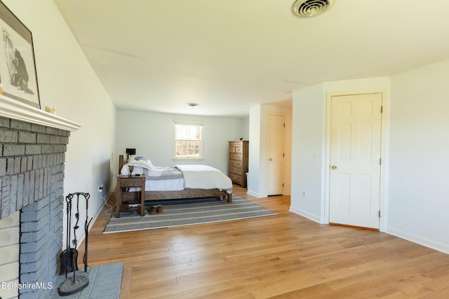 147 Brough Rd, Cheshire, MA 01225 - bedroom with visible vents, light wood-style flooring, baseboards, and a fireplace