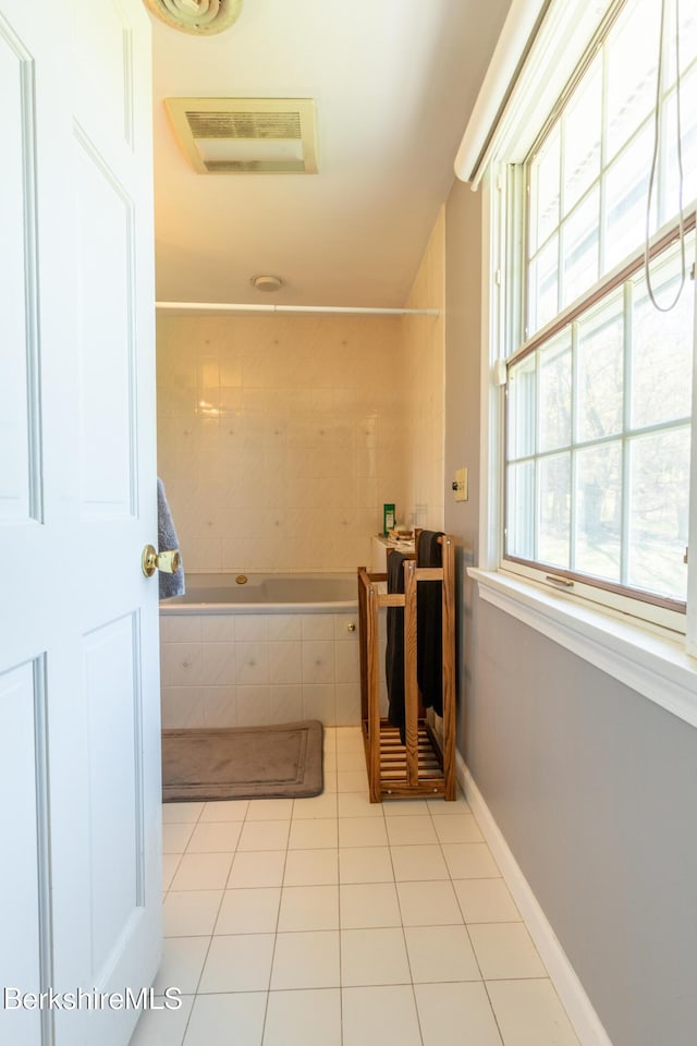 147 Brough Rd, Cheshire, MA 01225 - bathroom with tiled bath, tile patterned floors, and baseboards