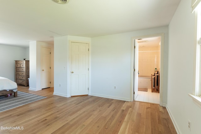 147 Brough Rd, Cheshire, MA 01225 - unfurnished bedroom featuring baseboards, ensuite bath, visible vents, and light wood-type flooring