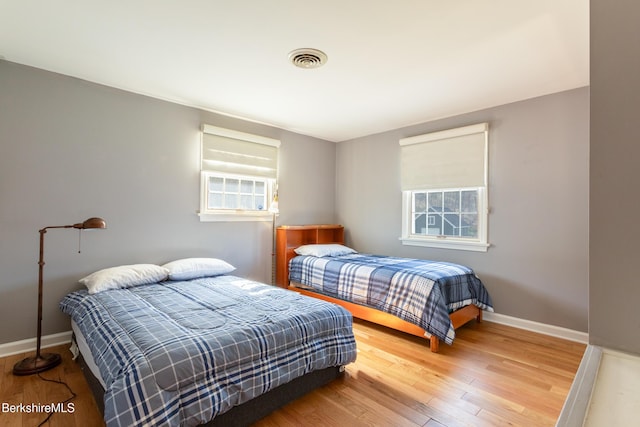 147 Brough Rd, Cheshire, MA 01225 - bedroom with visible vents, baseboards, wood finished floors, and multiple windows