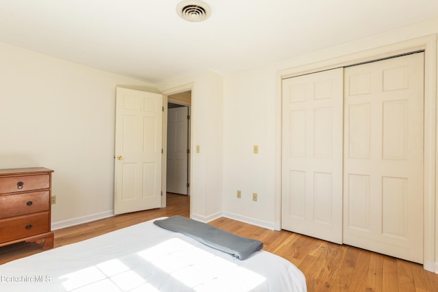 147 Brough Rd, Cheshire, MA 01225 - bedroom with baseboards, visible vents, light wood-style flooring, and a closet