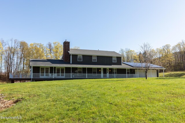 147 Brough Rd, Cheshire, MA 01225 - rear view of house featuring a lawn, a chimney, a porch, and a garage