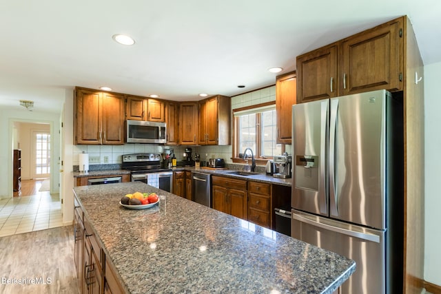 147 Brough Rd, Cheshire, MA 01225 - kitchen featuring brown cabinetry, a center island, recessed lighting, a sink, and appliances with stainless steel finishes