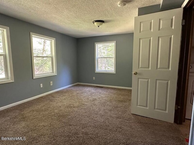 9 Woronoco Rd, Blandford, MA 01008 - unfurnished room featuring carpet flooring and a textured ceiling