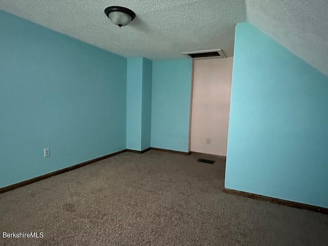 9 Woronoco Rd, Blandford, MA 01008 - carpeted empty room featuring a textured ceiling and baseboards