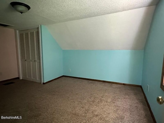 9 Woronoco Rd, Blandford, MA 01008 - bonus room with carpet flooring, lofted ceiling, and a textured ceiling