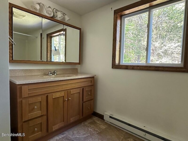 9 Woronoco Rd, Blandford, MA 01008 - full bathroom with a baseboard radiator, plenty of natural light, and vanity