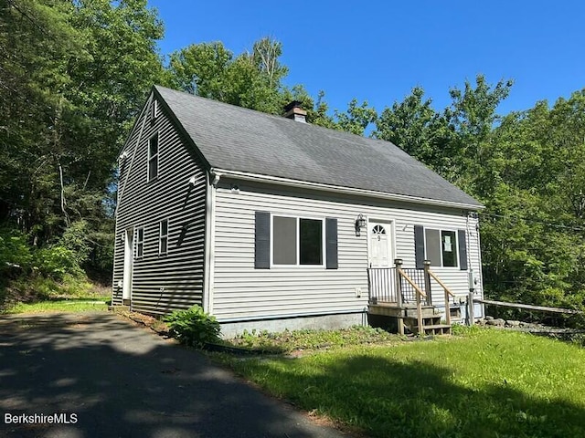 9 Woronoco Rd, Blandford, MA 01008 - new england style home featuring a chimney, a shingled roof, and a front yard