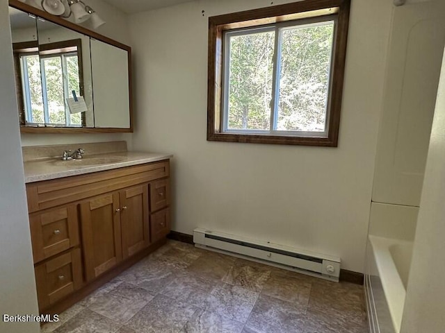 9 Woronoco Rd, Blandford, MA 01008 - full bathroom featuring a baseboard heating unit and vanity