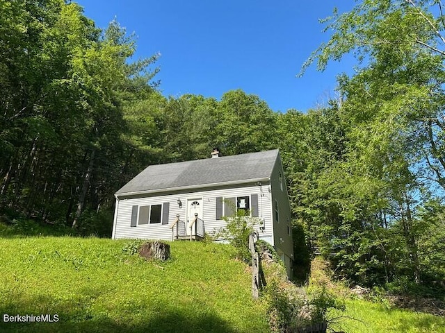 9 Woronoco Rd, Blandford, MA 01008 - view of front of property with a chimney and a view of trees