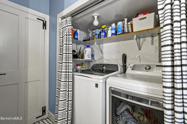 laundry room with washer and dryer and laundry area