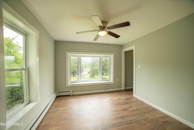 7 Hughes St, Adams, MA 01220 - spare room with healthy amount of natural light, a baseboard heating unit, wood finished floors, and a ceiling fan