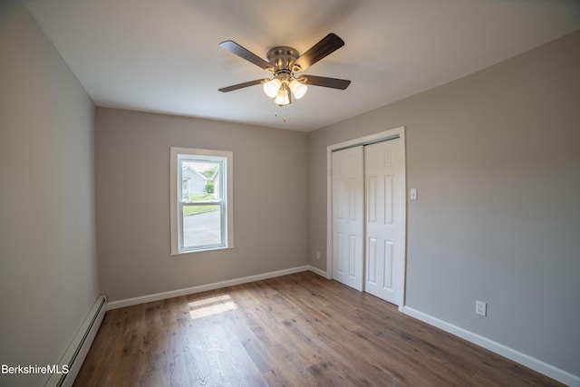 7 Hughes St, Adams, MA 01220 - unfurnished bedroom with a baseboard radiator, wood finished floors, a closet, and ceiling fan