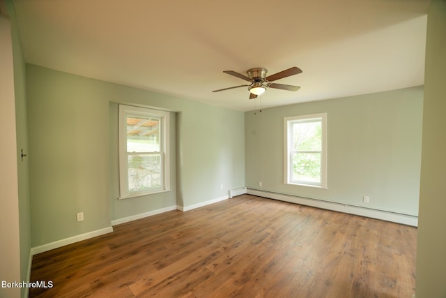 7 Hughes St, Adams, MA 01220 - unfurnished room featuring baseboard heating, wood finished floors, and a ceiling fan