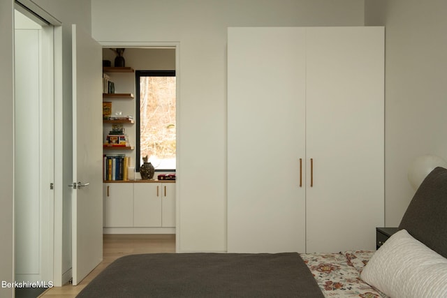 bedroom with light wood-type flooring