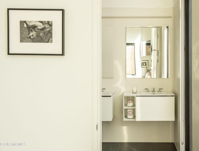 bathroom featuring tile patterned flooring and vanity