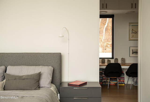 bedroom featuring dark wood-style floors