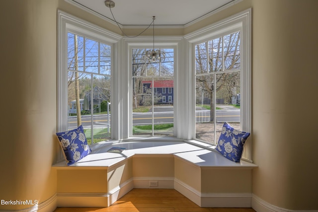 unfurnished room featuring baseboards and wood finished floors