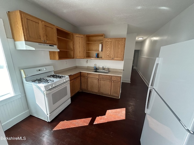 kitchen with open shelves, light countertops, a sink, white appliances, and under cabinet range hood