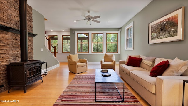 11 Jamie Ln, Sandisfield, MA 01255 - living room featuring light wood-style floors, ceiling fan, a wood stove, recessed lighting, and baseboards