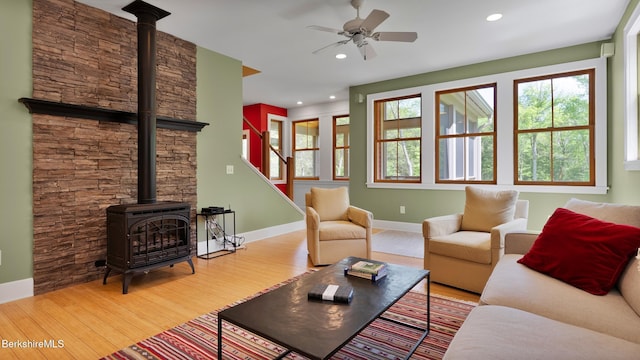 11 Jamie Ln, Sandisfield, MA 01255 - living room with a wood stove, ceiling fan, wood finished floors, baseboards, and recessed lighting