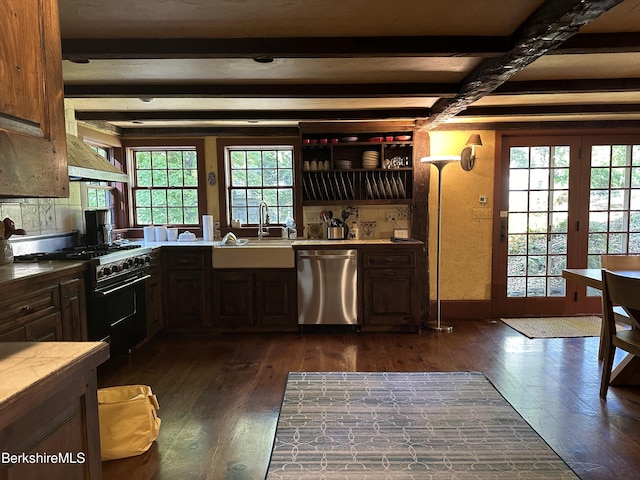 kitchen with dishwasher, high end black range, dark wood-type flooring, sink, and beam ceiling