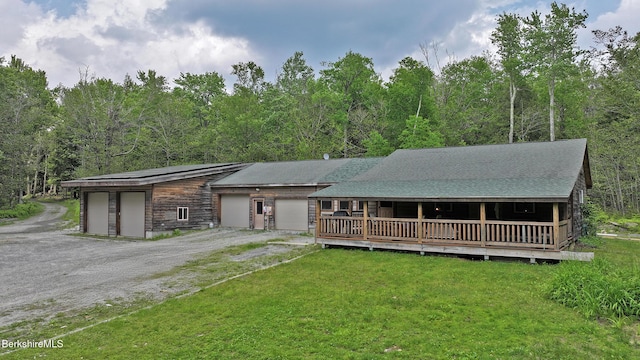 289 Algerie Rd, Becket, MA 01223 - view of front facade featuring a front yard, dirt driveway, and a garage