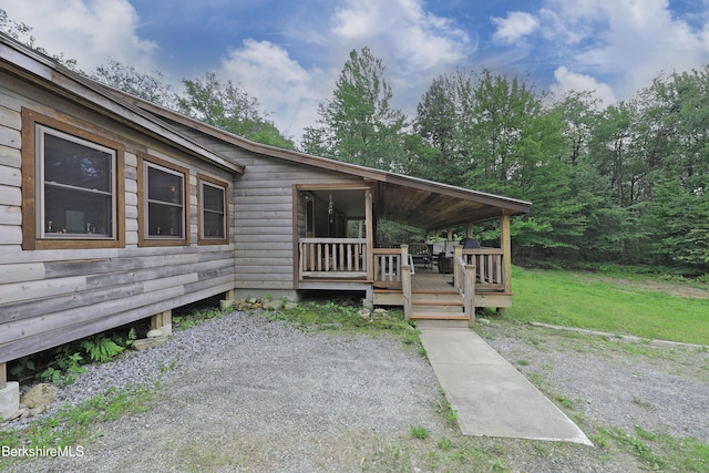 289 Algerie Rd, Becket, MA 01223 - view of front facade with a deck and a front lawn