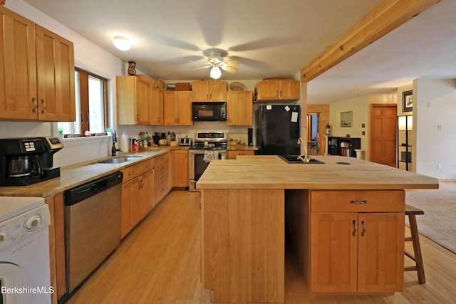 289 Algerie Rd, Becket, MA 01223 - kitchen with black appliances, wood counters, light wood finished floors, a breakfast bar, and a ceiling fan