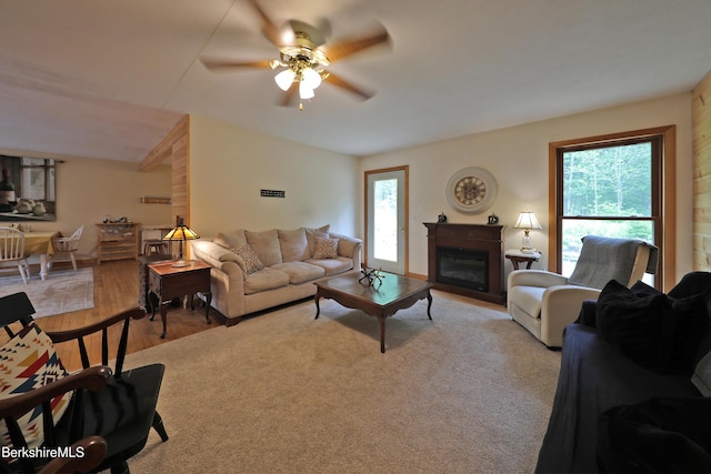 289 Algerie Rd, Becket, MA 01223 - living area with ceiling fan, plenty of natural light, light wood finished floors, and a glass covered fireplace
