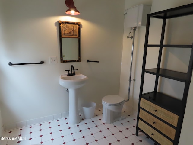 bathroom featuring sink and toilet