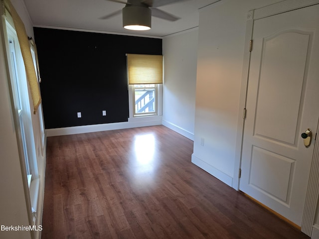 unfurnished bedroom featuring crown molding, ceiling fan, and hardwood / wood-style flooring