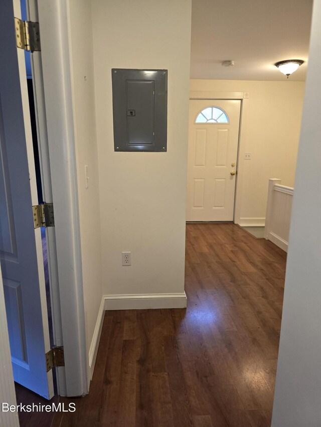 unfurnished bedroom with hardwood / wood-style floors, connected bathroom, a closet, and radiator